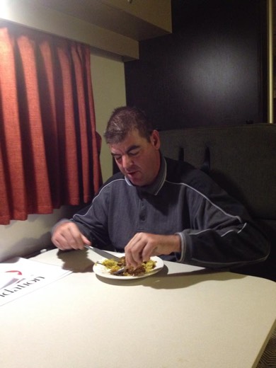 Gary eating Lamb Tagine in the campervan at the end of Day 3