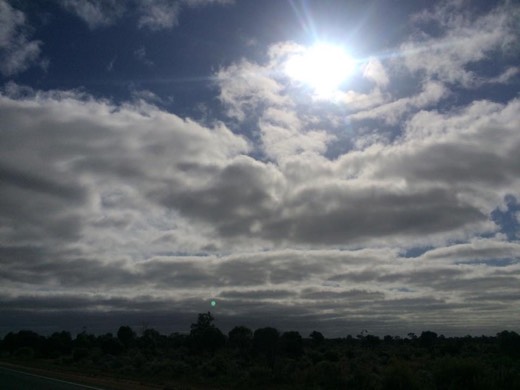 Clouds and open sky over the Eyre Highway on the way to the 90 Mile Straight.