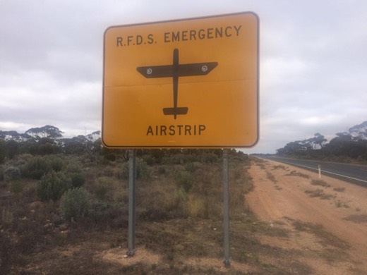 Roadside sign marking an RFDS emergency airstrip section of the Eyre Highway