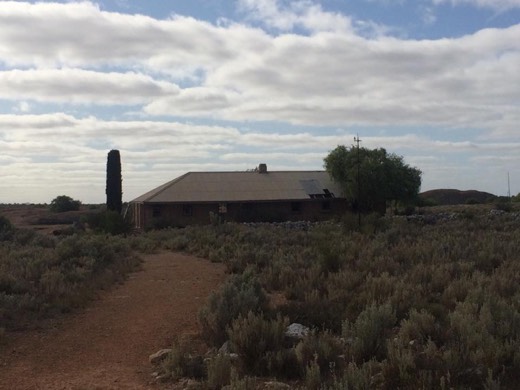 A small roadside ruin or chimney beside the Eyre Highway.