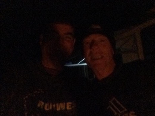 Gary with Glenn Carter at night beside the support vehicles