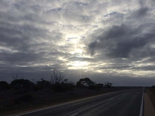 Sun breaking through cloud over the Eyre Highway on Day 32