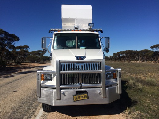 Large white road train stopped beside the Eyre Highway
