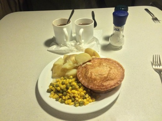 Jitter Bean Oasis pie served with potatoes, vegetables, and gravy in the campervan.