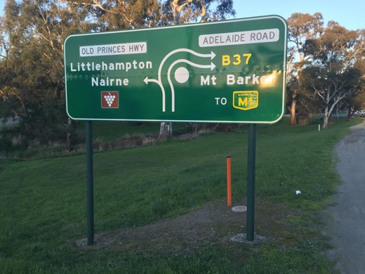 Road sign pointing left to Nairne and Littlehampton, prompting a Narnia joke.