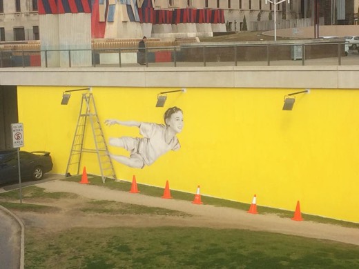 Progress on Yvonne's flying-boy mural near the Adelaide Festival Centre.