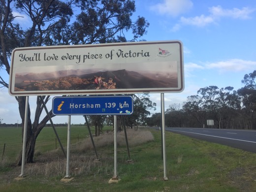 Welcome to Victoria tourist sign beside the highway showing Horsham 139 kilometres away