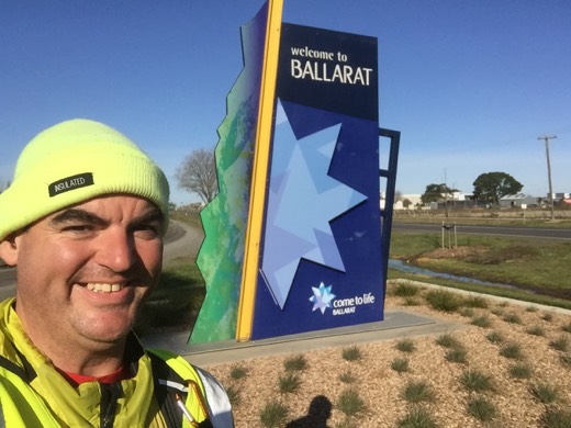 Gary beside the Welcome to Ballarat sign on Day 77