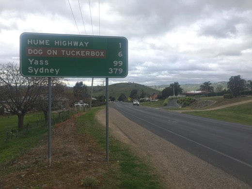 Hume Highway sign showing Dog on Tuckerbox, Yass and Sydney distances.