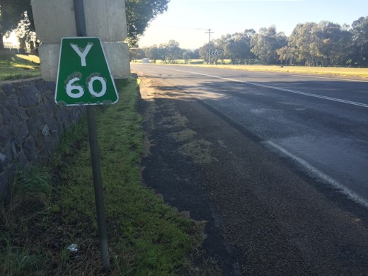 Road sign showing Yass 60 kilometres away during Day 95.