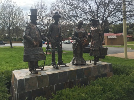 Gundagai bronze figures on a footpath in town.