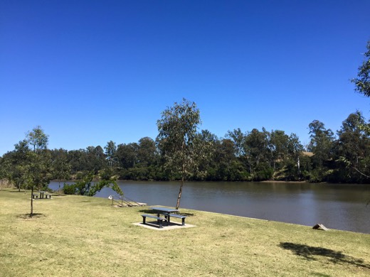 Riverside picnic tables near Jindalee in clear spring weather.
