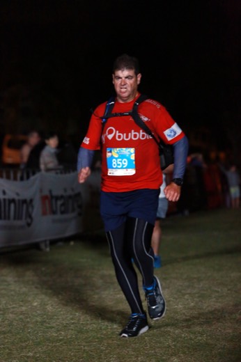 Gary running after dark at the Twilight Bay Run.