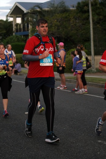 Gary running past spectators at the Twilight Bay Run.