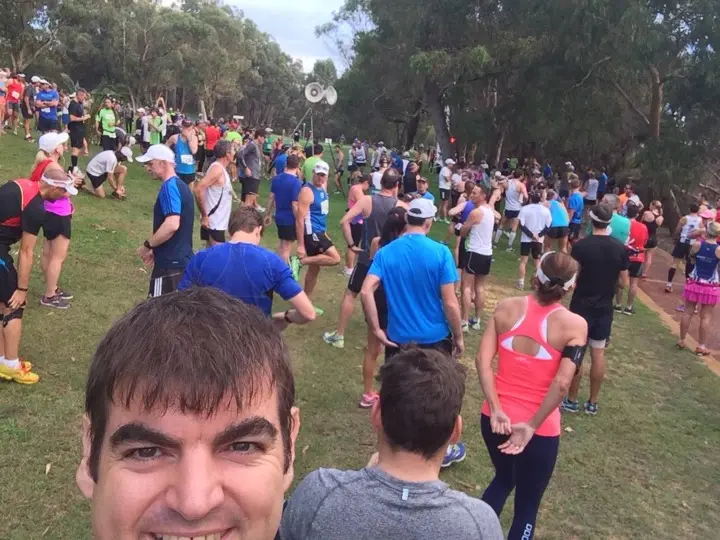 Gary taking a selfie at a crowded Joondalup Half Marathon start area at Neil Hawkins Park in 2014