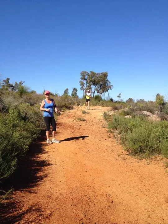 Renee Notman and Pete Shinnick on a red dirt trail at John Forrest National Park