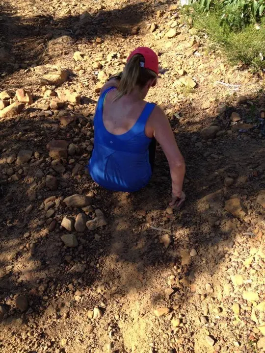 Renee Notman sitting on a loose rocky section of the Eagle Trail