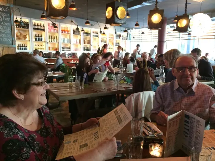 Gary's mum and dad reading menus at Jamie's Italian on Canary Wharf