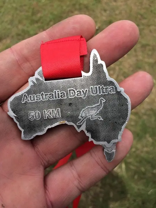 Australia Day Ultra 50 km medal held in Gary's hand