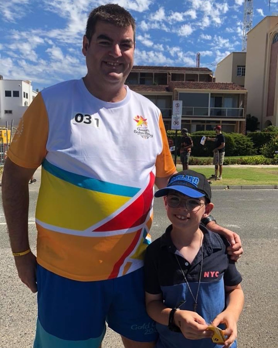 Gary wearing his Queen's Baton Relay uniform with his son in South Perth.